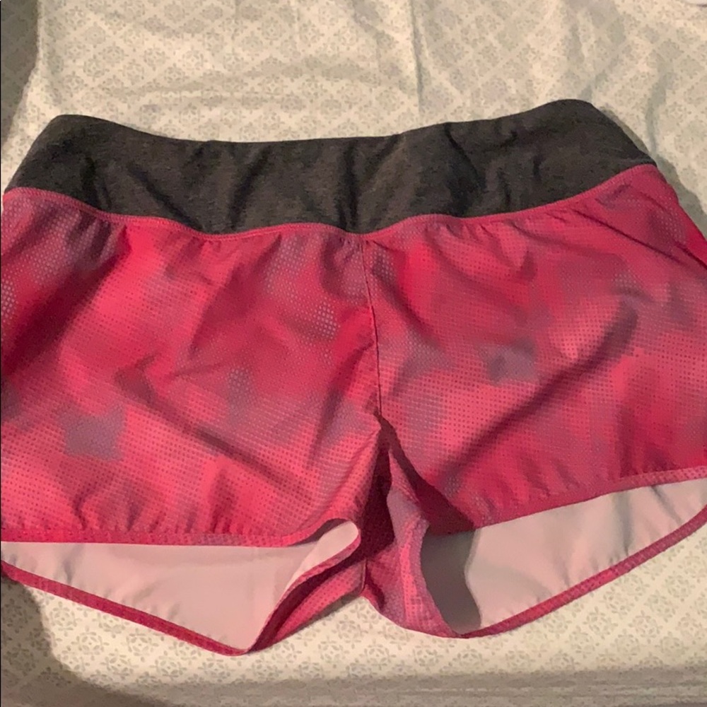 Pink athletic shorts with pocket